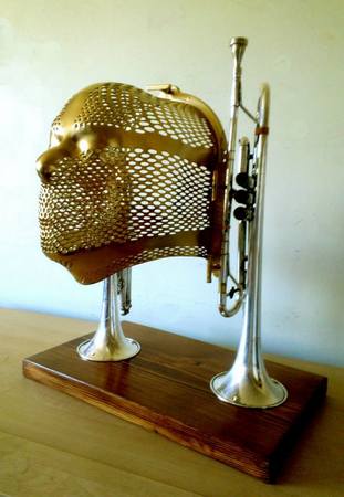 "Music Man"
Sculpture
Radiation mask, vintage horn instruments, wood, 
paint