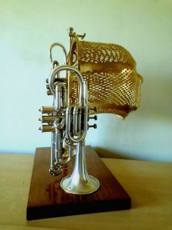 "Music Man"
Sculpture
Radiation mask, vintage horn instruments, wood, 
paint