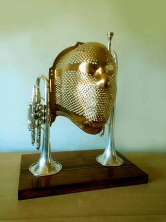 "Music Man"
Sculpture
Radiation mask, vintage horn instruments, wood, 
paint